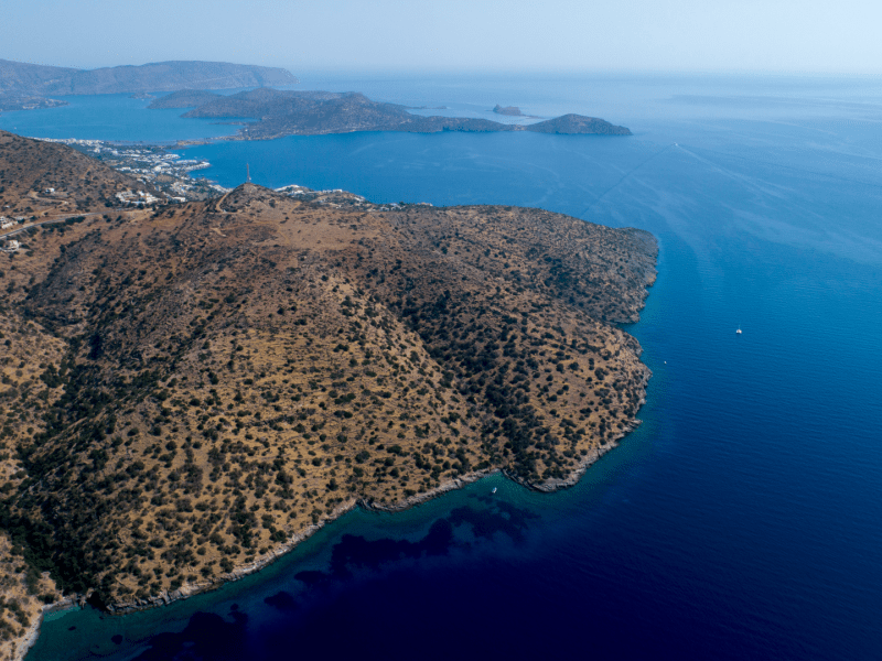 Birds eye view of a mountain on the water