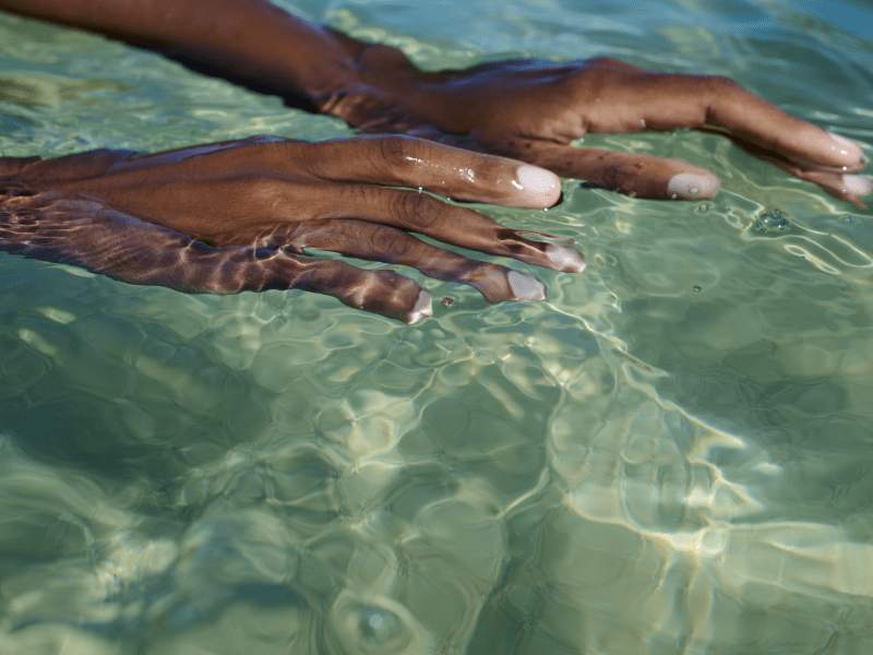 hands in water