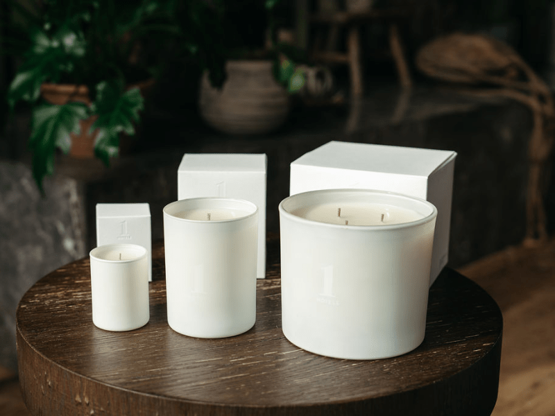 1 Hotels candles sitting on a table