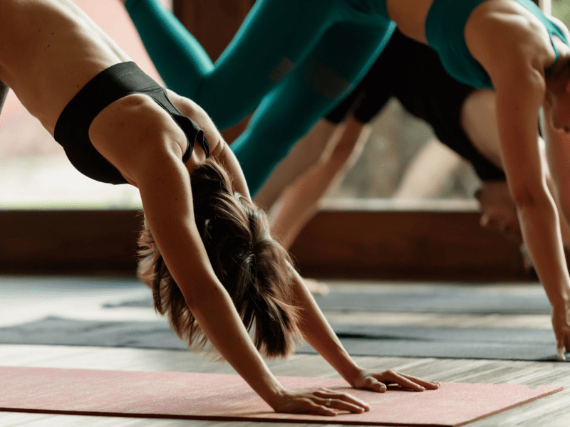 Three people doing yoga