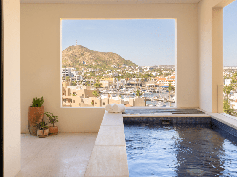 Personal pool on a patio overlooking a city