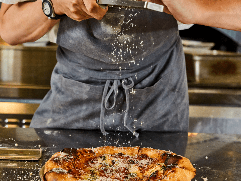 Chef Plating Pizza at Barbuto Brooklyn
