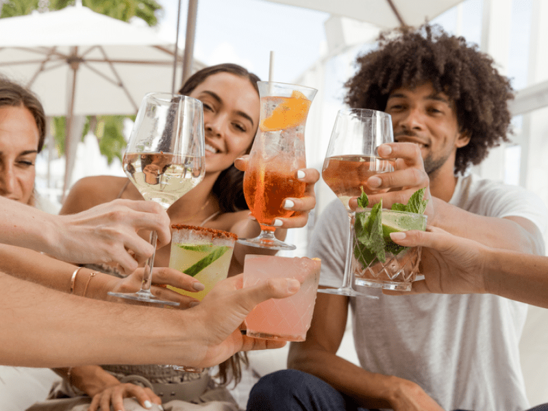 People raising their glasses to a toast