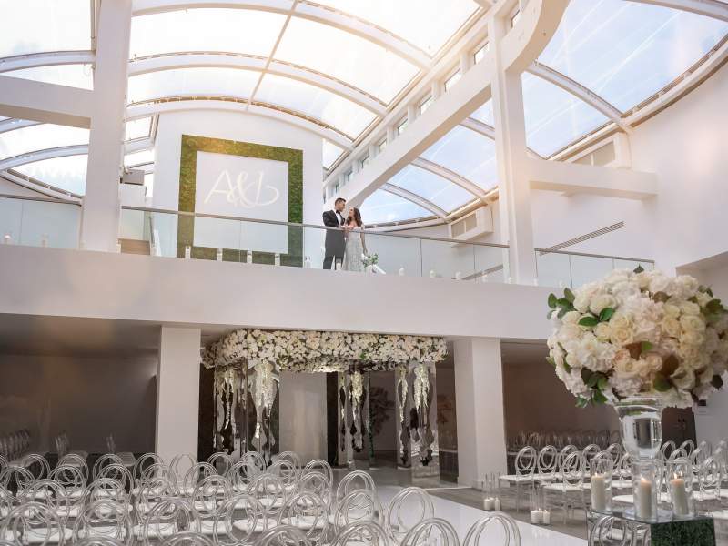 Wedding couple standing over their wedding venue