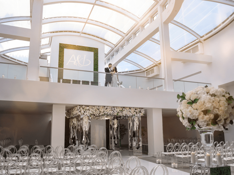 Wedding couple standing over their wedding venue