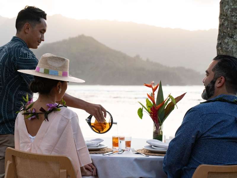 A couple enjoying dinner on the beach