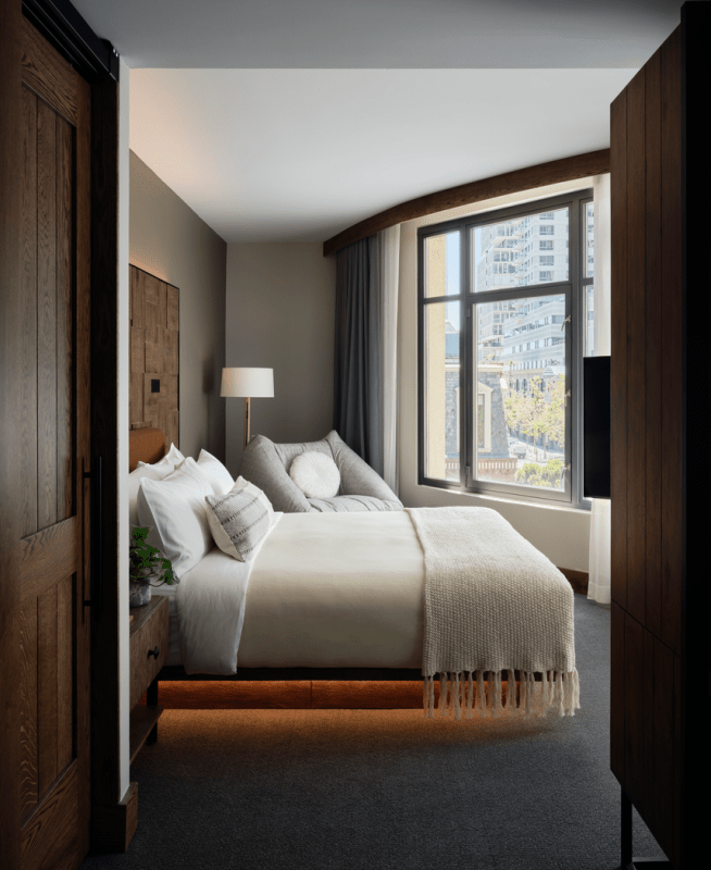 Looking into a Studio suite room with king bed overlooking views of the city