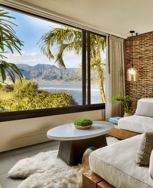 a room with large windows and a beach-view