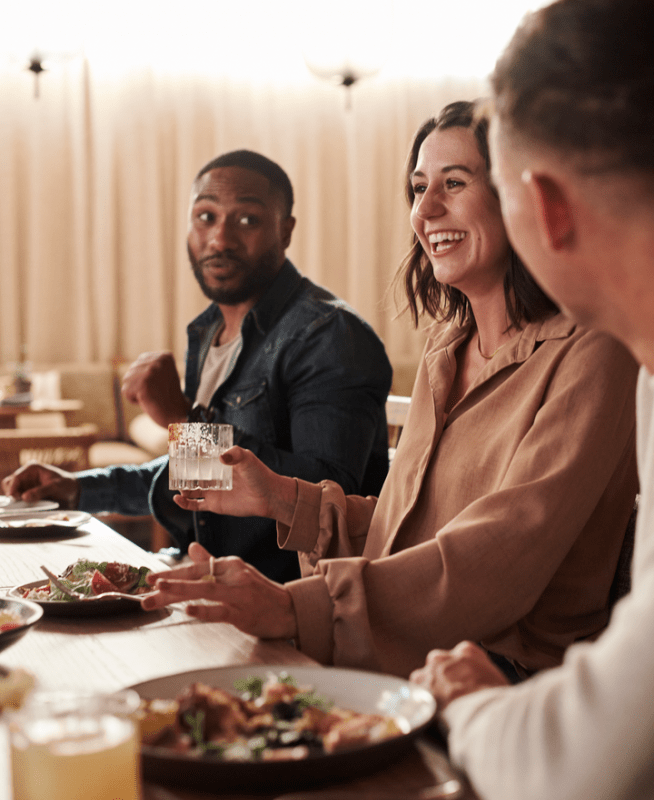 People enjoying dinner and drinks at 1 Kitchen 