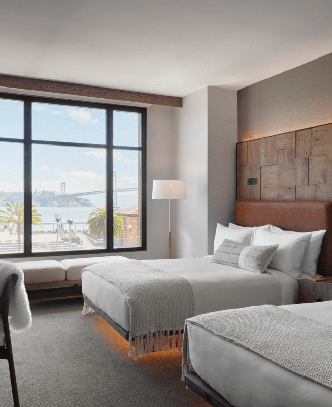 Two queen beds overlook the nearby waterfront