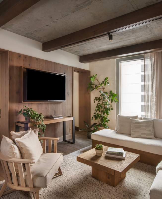 Wood paneled living room with a sectional couch