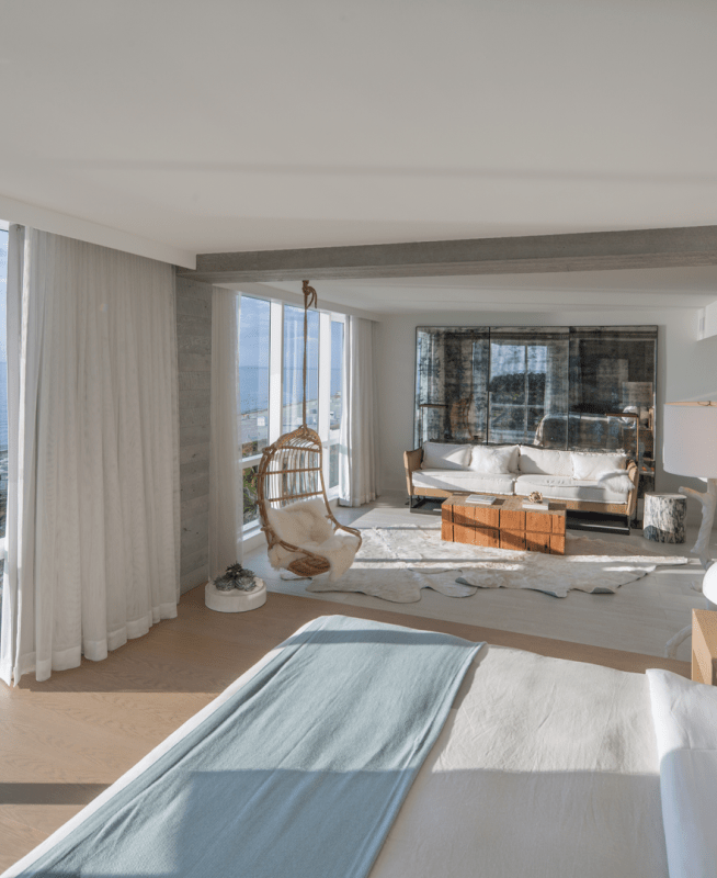 Presidential Suite for 1 Hotel South Beach complete with panoramic views of the water and a fully furnished living room area adjacent to the king size bed