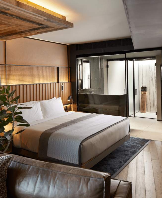 Hotel room with bed in the middle of room 