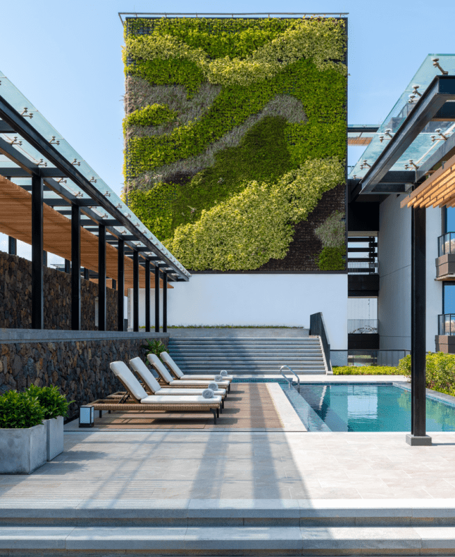 An eco-friendly green wall provides a refreshing backdrop to the Sky Villa pool area