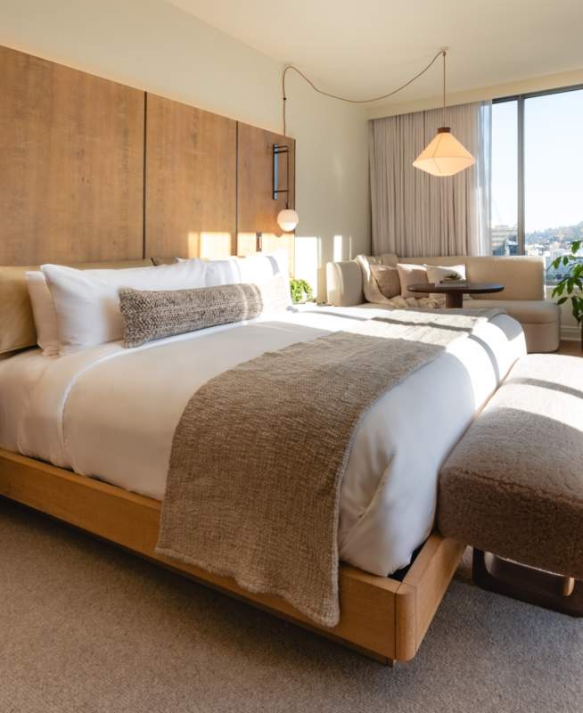 hotel room with bed and natural light