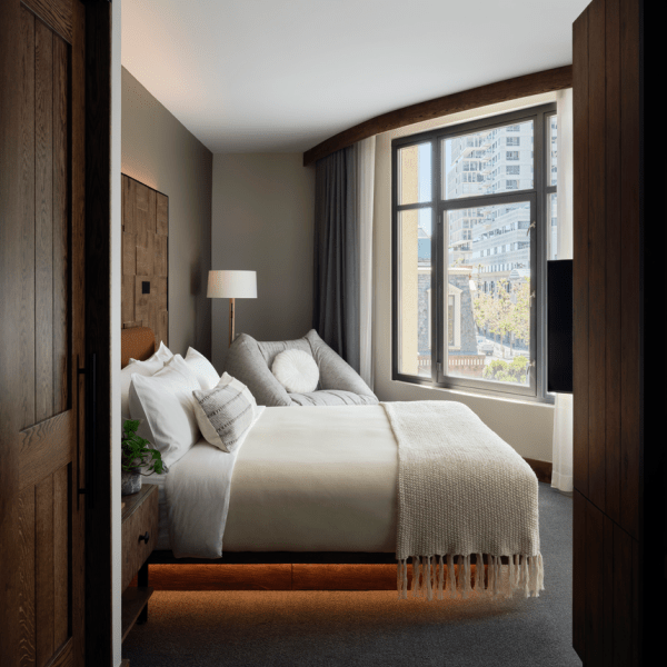 Looking into a Studio suite room with king bed overlooking views of the city