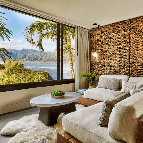 a room with large windows and a beach-view