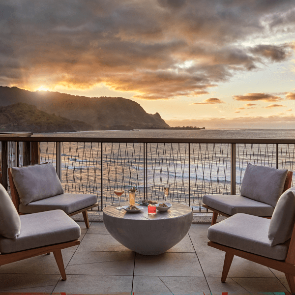 Lounge area on a deck overlooking the ocean at Welina Terrace