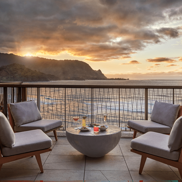 Lounge area on a deck overlooking the ocean at Welina Terrace