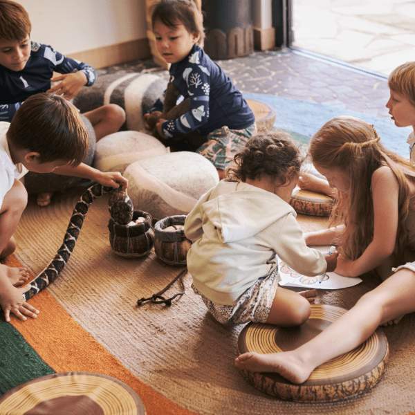 Children gathering on a floor rug