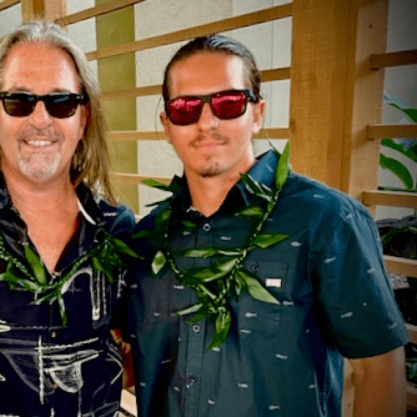 Three people with sunglasses, posing for a photo
