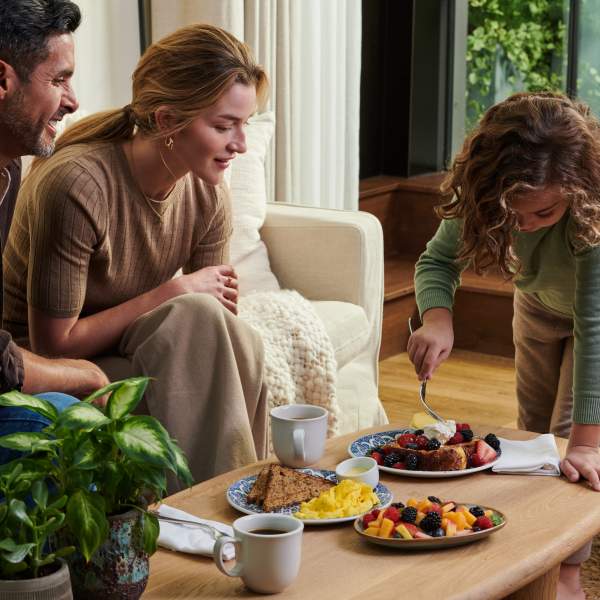 Family enjoying food at table