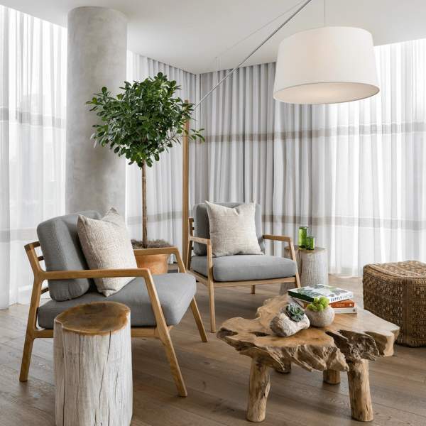 Bright living room with chairs and a live edge coffee table