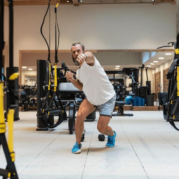 Person shadow boxing in a fitness center