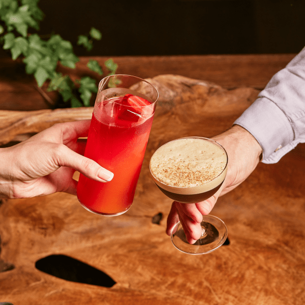 two people with cocktails