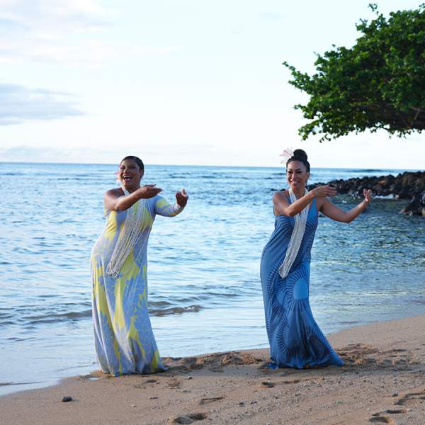 Women dancing on the beach