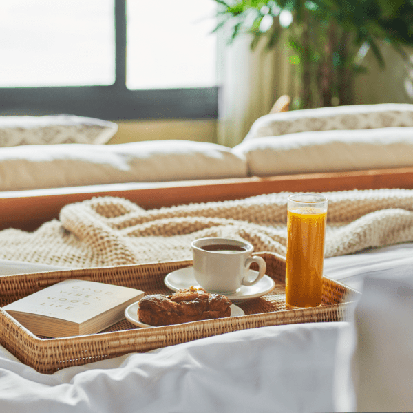 Tray of breakfast food in bed