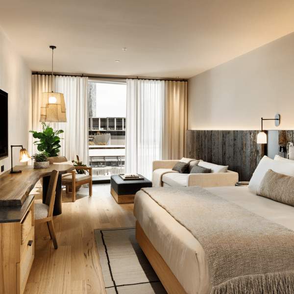 Bedroom with seating area and desk