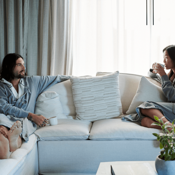 Two people relaxing on a couch