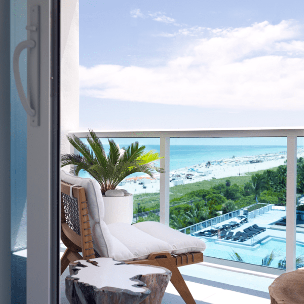 Ocean View Jr Suite King Bed With Balcony overlooking the water and beachfront