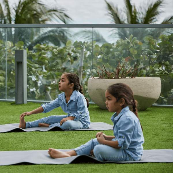 Children doing yoga outside