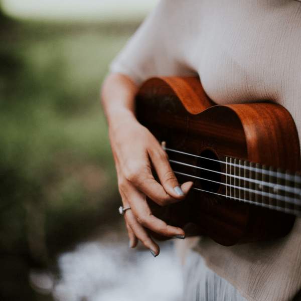Person playing a ukulele