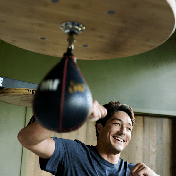 person using a speed bag