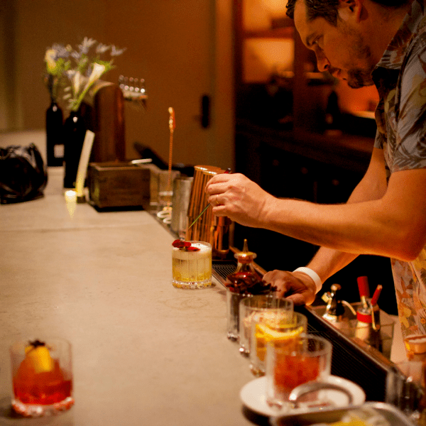Bartender finishing up a drink