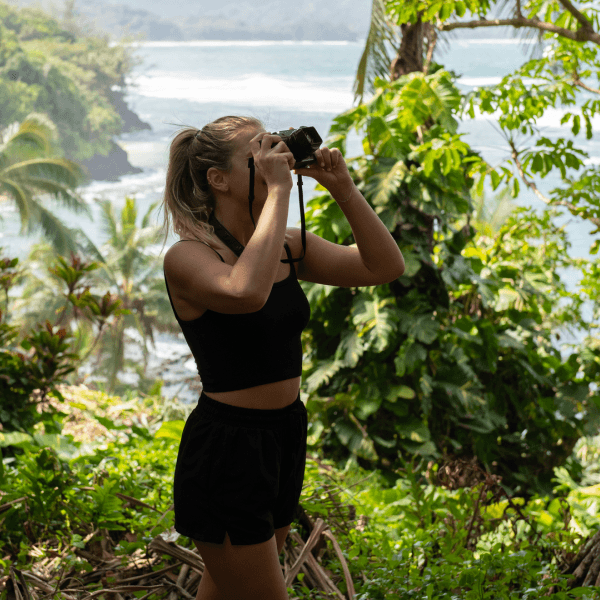 a woman taking a photo of nature