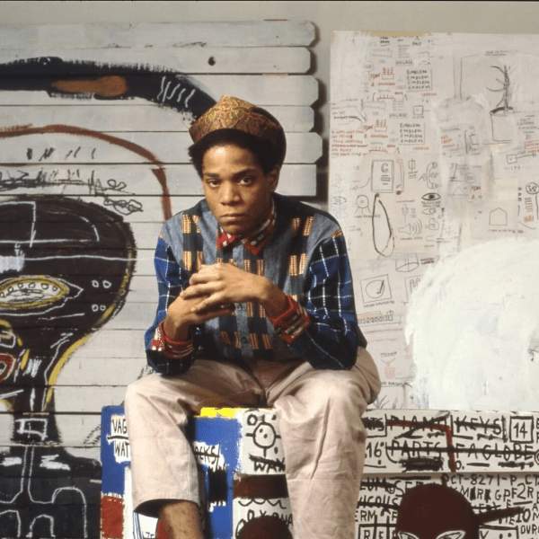 Basquiat in front of artwork
