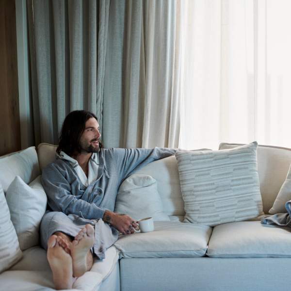 Couple on the couch in robes