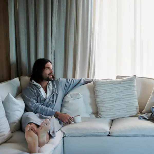 Couple on the couch in robes