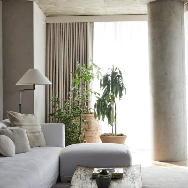A couch with an ottoman and coffee table