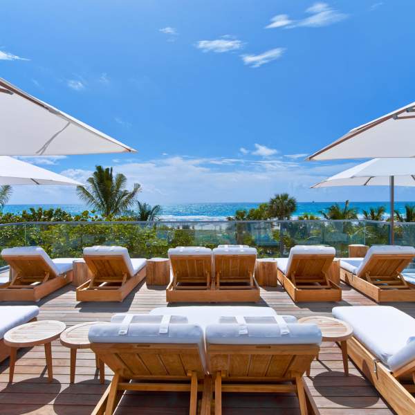 Lounge chairs with umbrellas