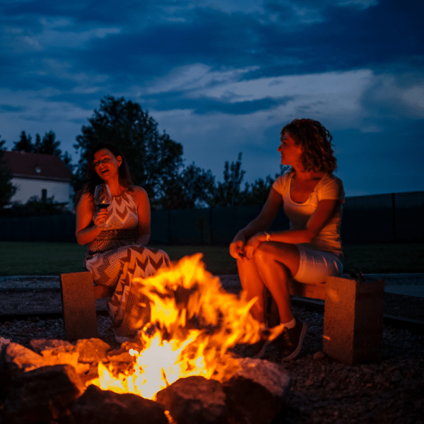 People sitting around a campfire 