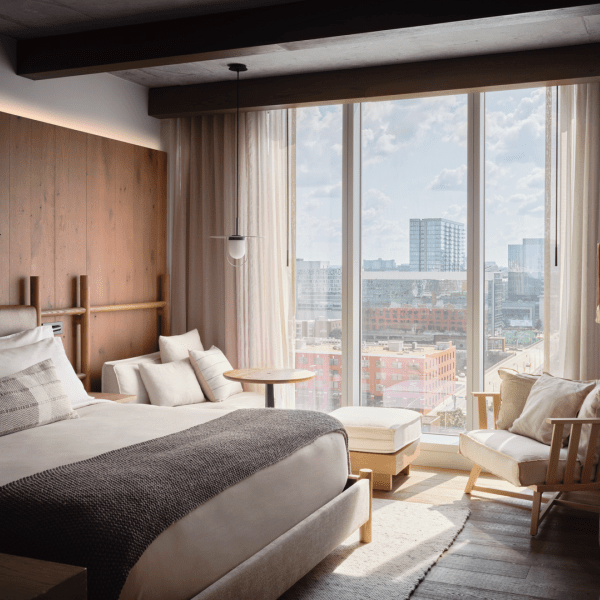 Wide windows allow in plenty of natural light, bathing the king size bed in sun