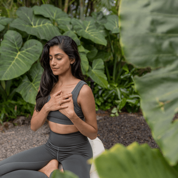 Women meditating outside