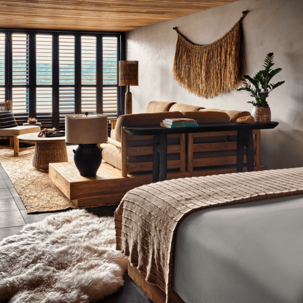 Bedroom with king size bed overlooks a spacious living area 