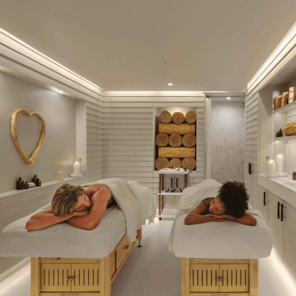 Two people on massage tables at 1 South Beach
