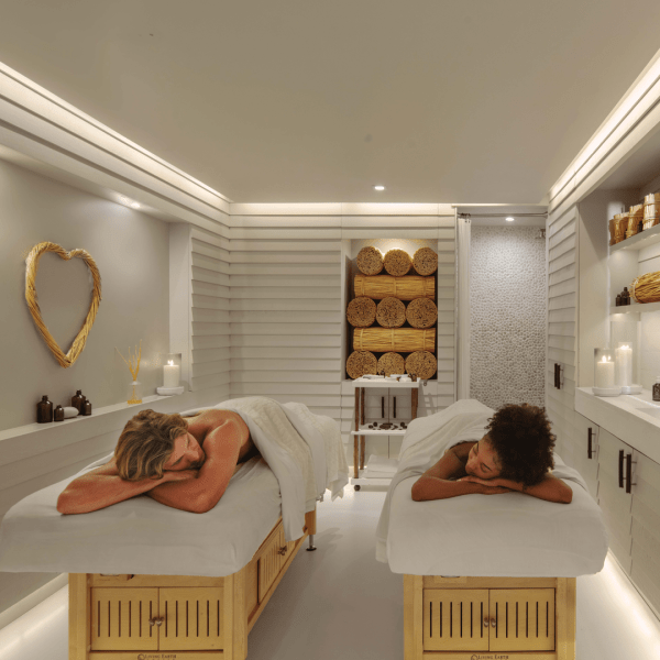 Two people on massage tables at 1 South Beach